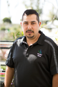 Rigo Hernandez, Wholesale Sales representative at Green Hills Nursery, wearing a Green Hills Nursery-branded polo shirt.